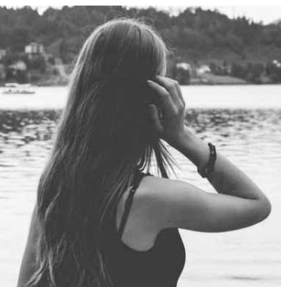 a woman standing near water, fertilitet